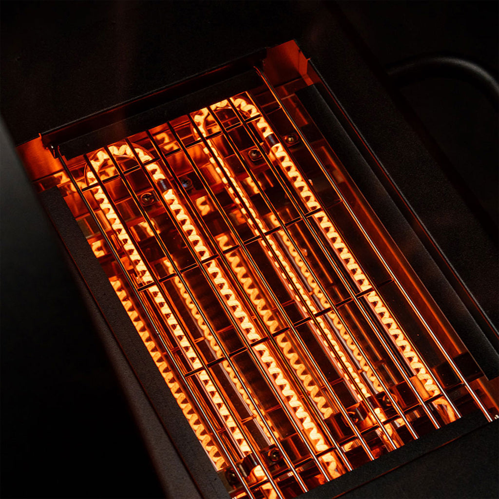 The Green Mountain Grills SideBurn heating elements glowing red hot.