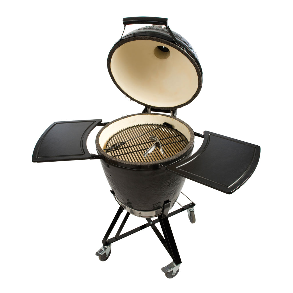 Primo Grill's Round Charcoal Kamado with dome open and in Primo Grill Stand and Side Shelves.