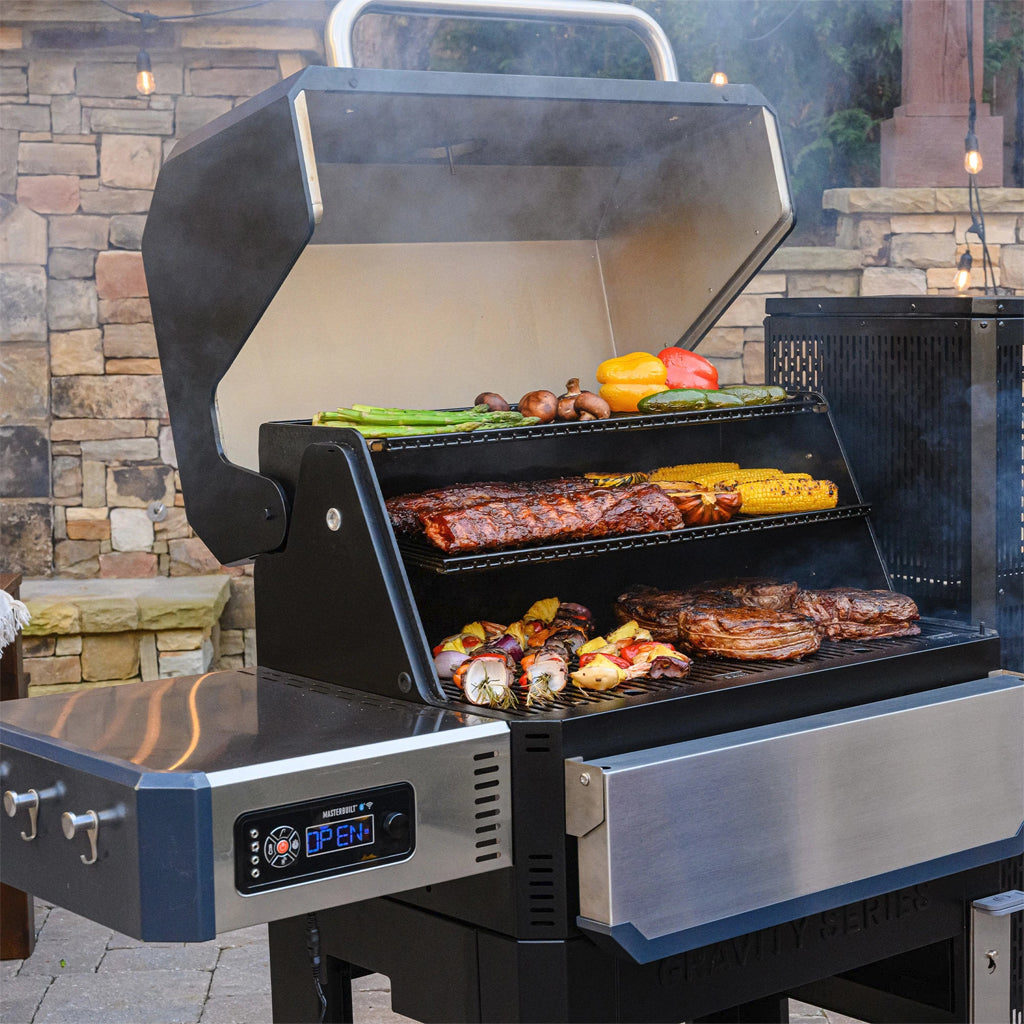 Masterbuilt Gravity Series Grills for charcoal grilling and smoking, with optional griddle, pizza oven and rotisserie. Digital controls for easy temperature management and monitoring.